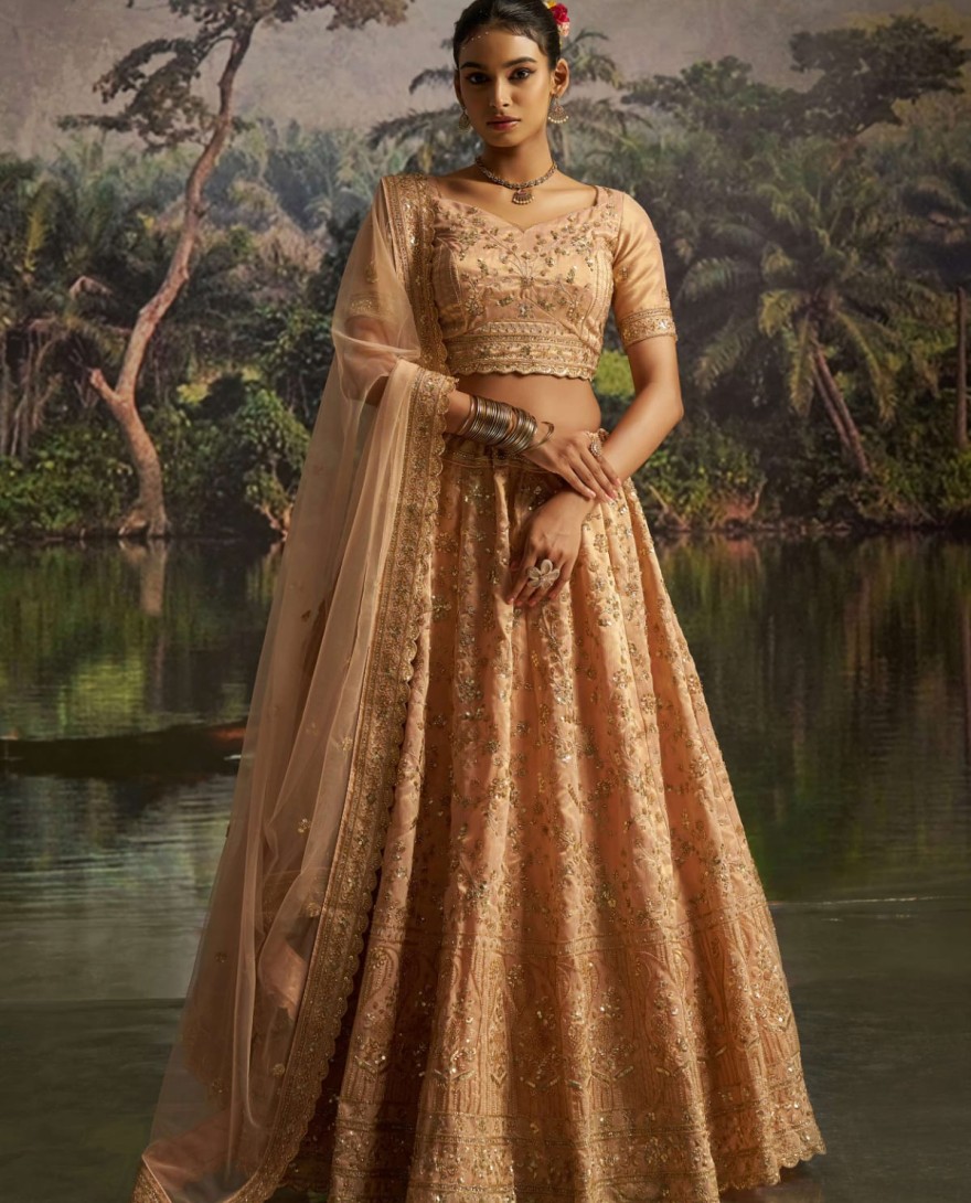 100005 - Tantalizing Peach Net Sequins Embroidered Traditional Lehenga Choli