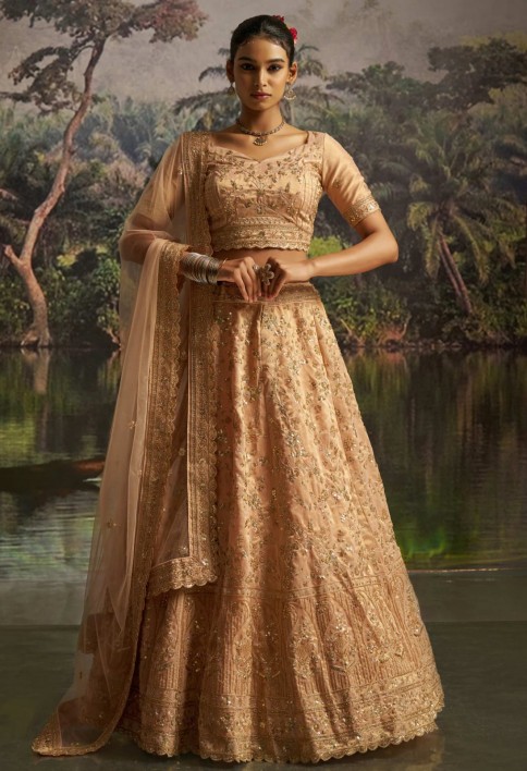 Tantalizing Peach Net Sequins Embroidered Traditional Lehenga Choli