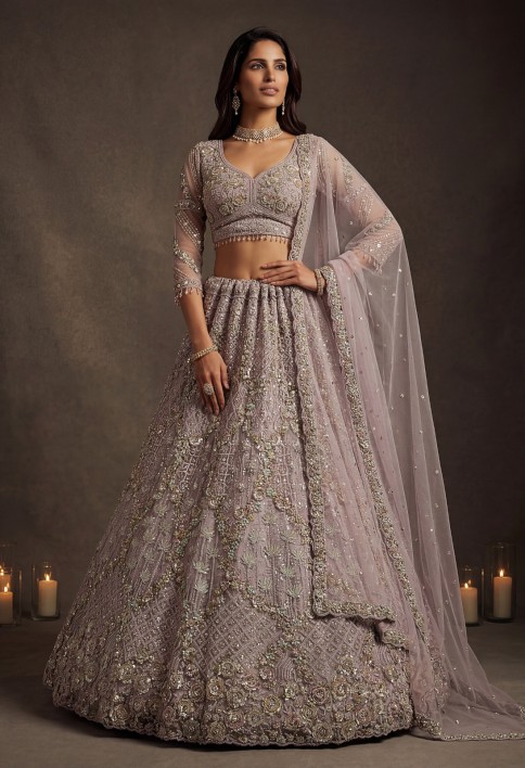Notable Mauve Multi Thread Work Net Reception Wear Lehenga With Blouse